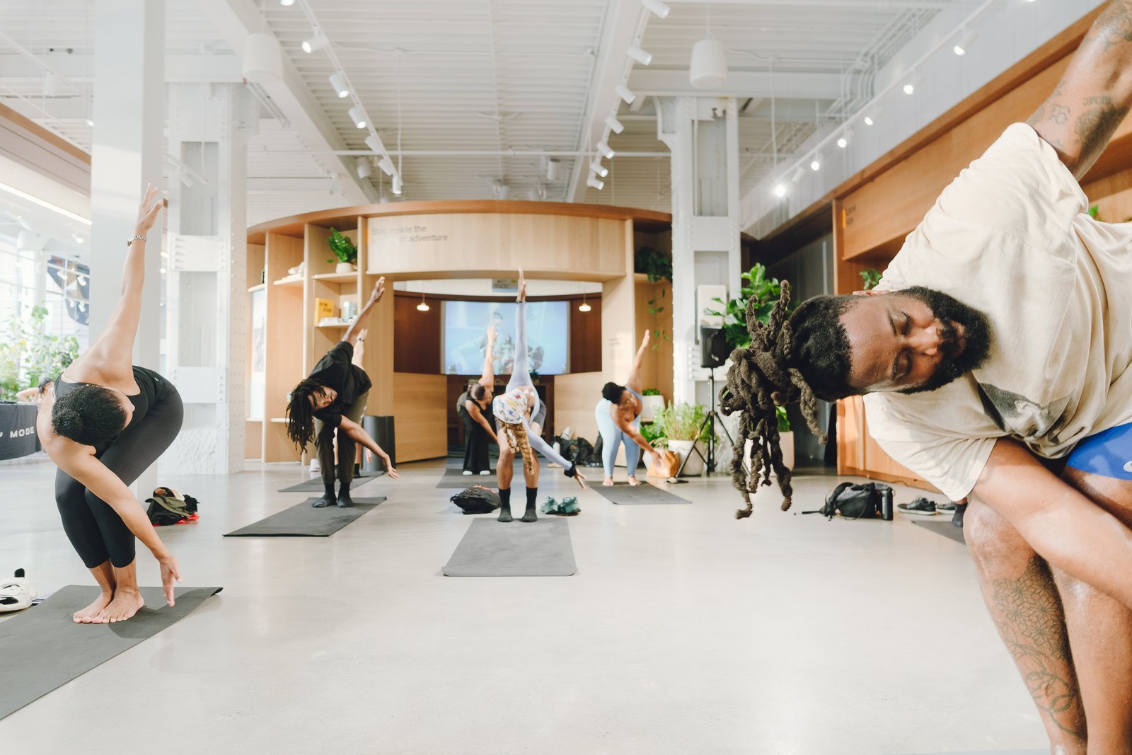 Group flow sequence mid-movement inside the Rivian showroom