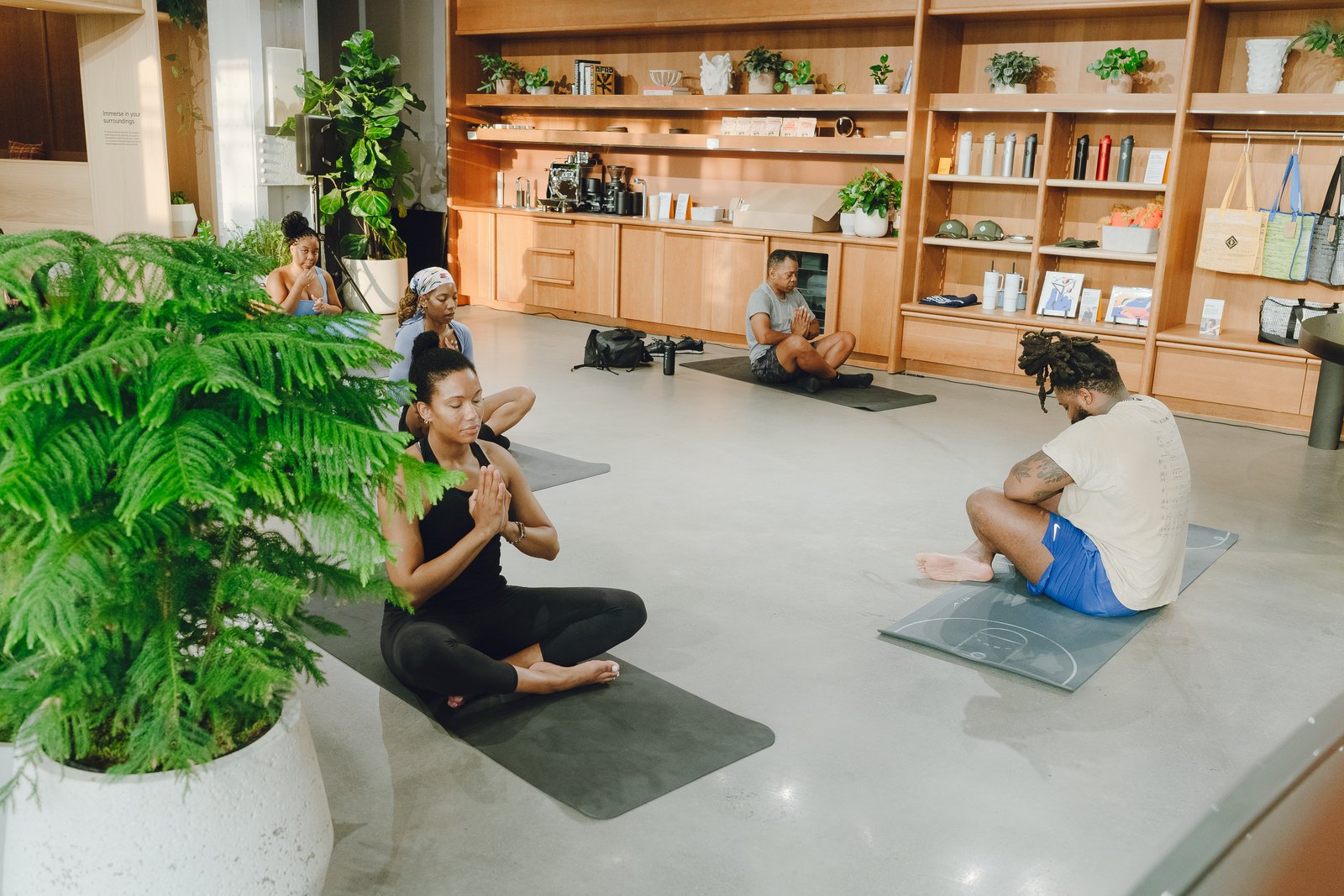 Leading a seated meditation session inside the Rivian showroom